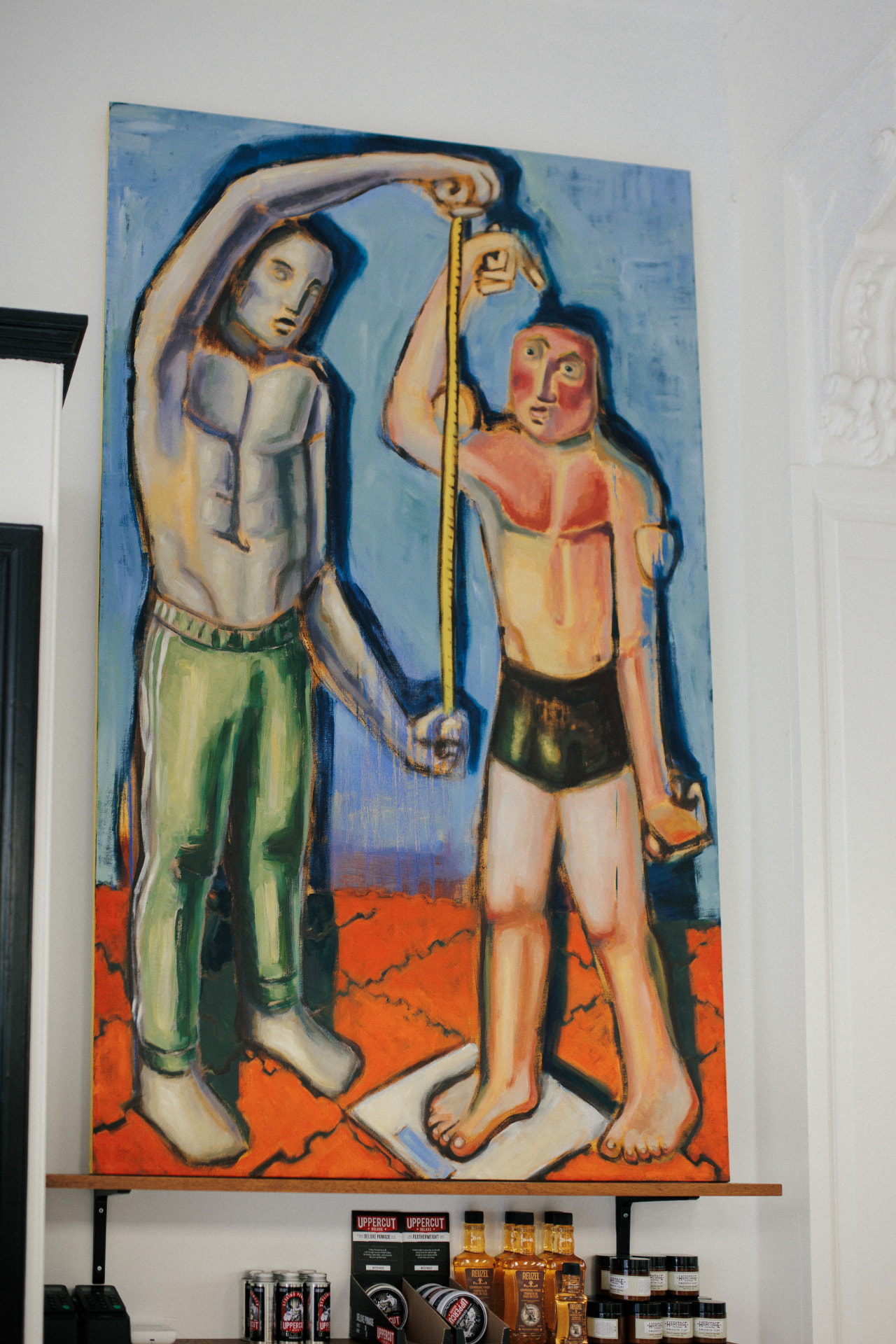 Schilderij in de ruimte bij Daggers Barbershop